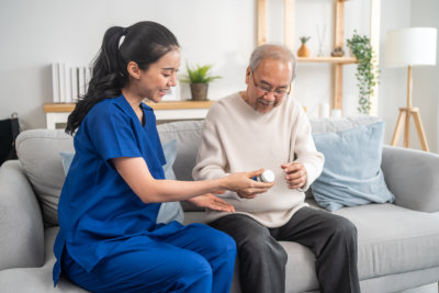 caregiver explain the medication to her patient