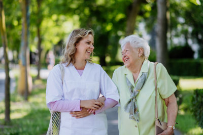 caregiver accompany her patient outside