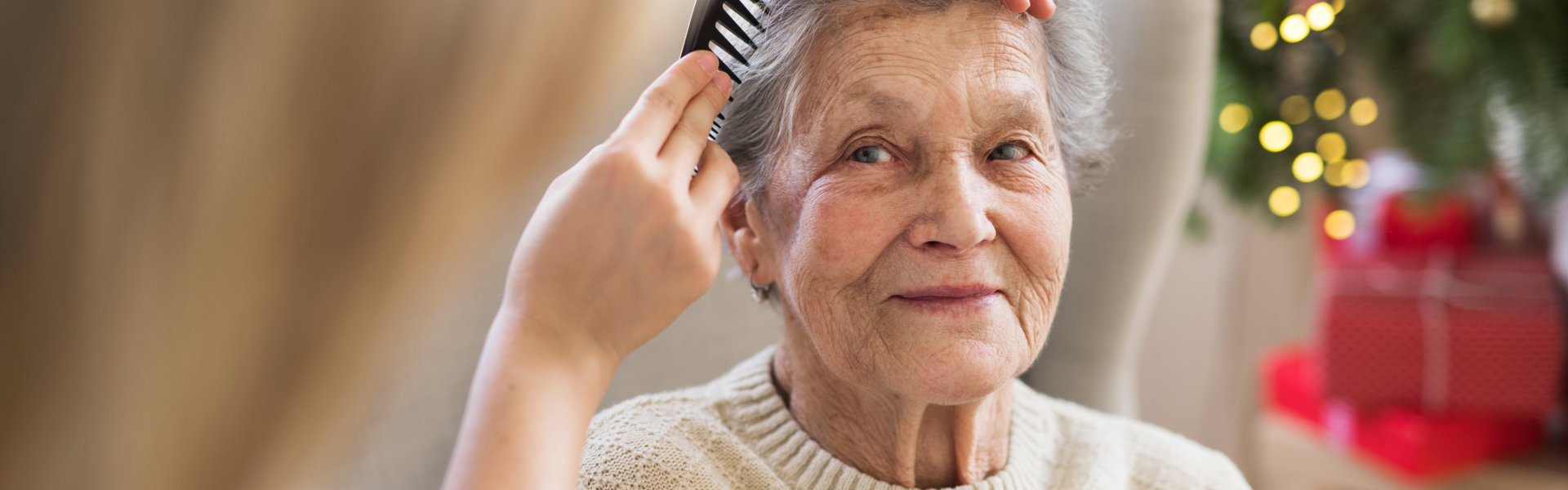 caregiver comb her patient's hair